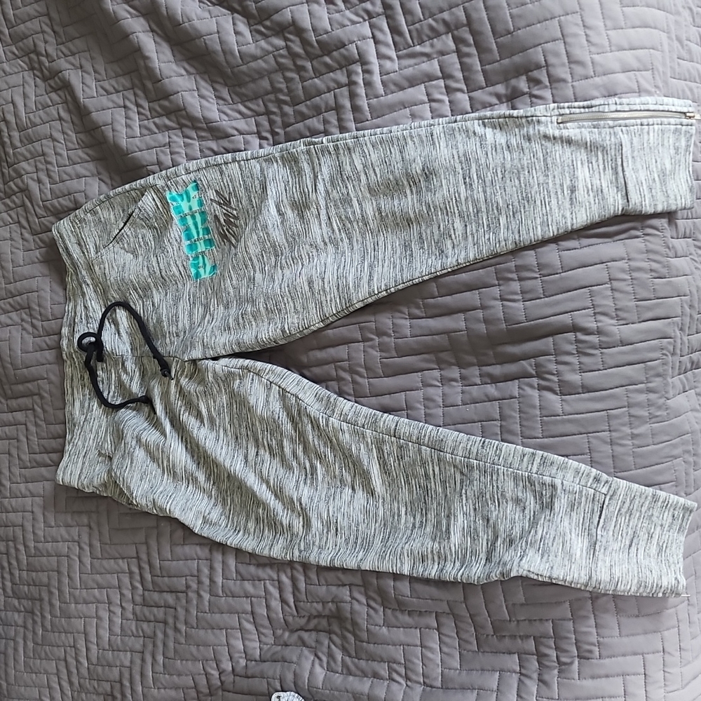 PINK sweat pants with zippered ankle.